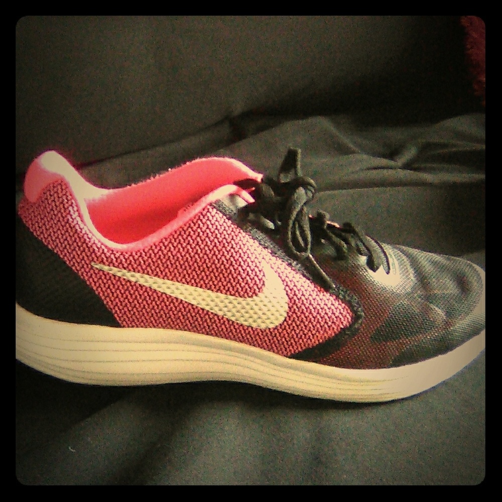 Comfortable pink Nike tennis shoes.